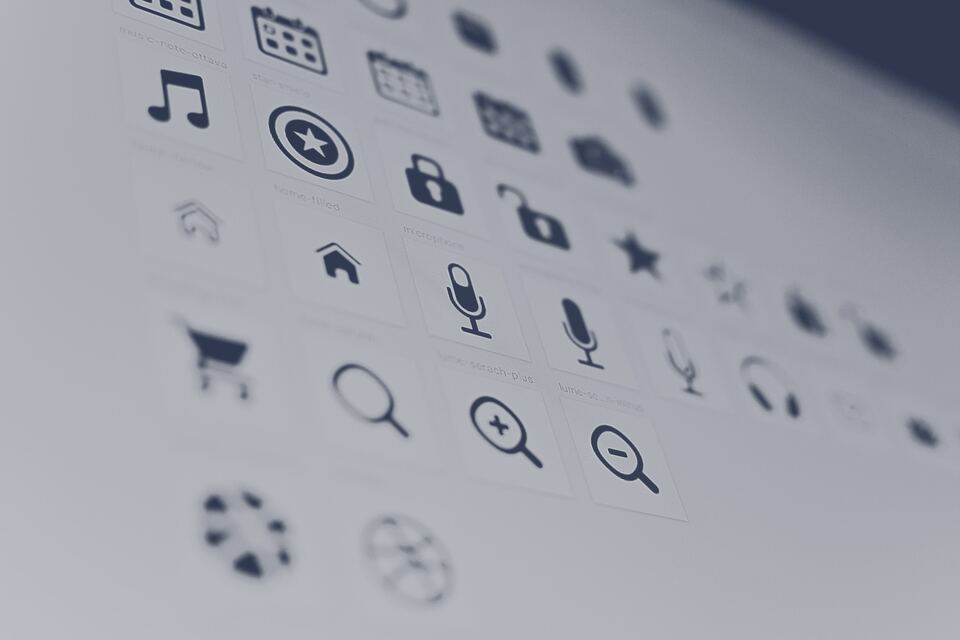 The image shows a variety of common digital icons displayed on a light background, including symbols for music, security, search, cart, and settings.